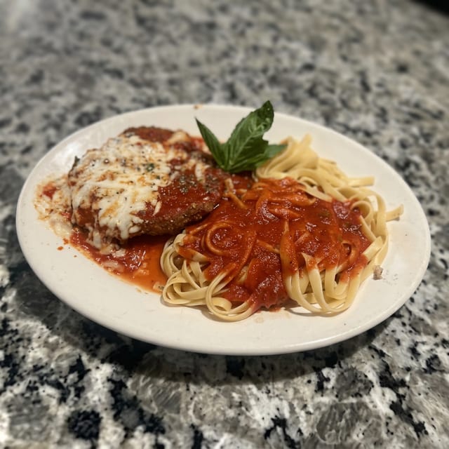 Chicken Parmesan Over Fettuccine.